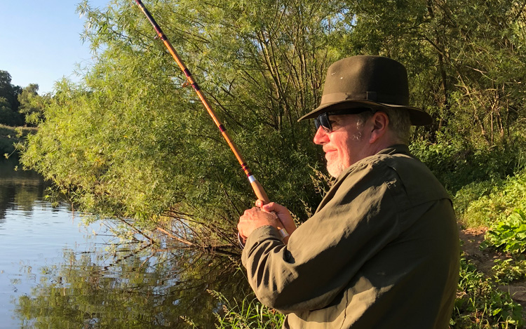 John Haynes playing a barbel